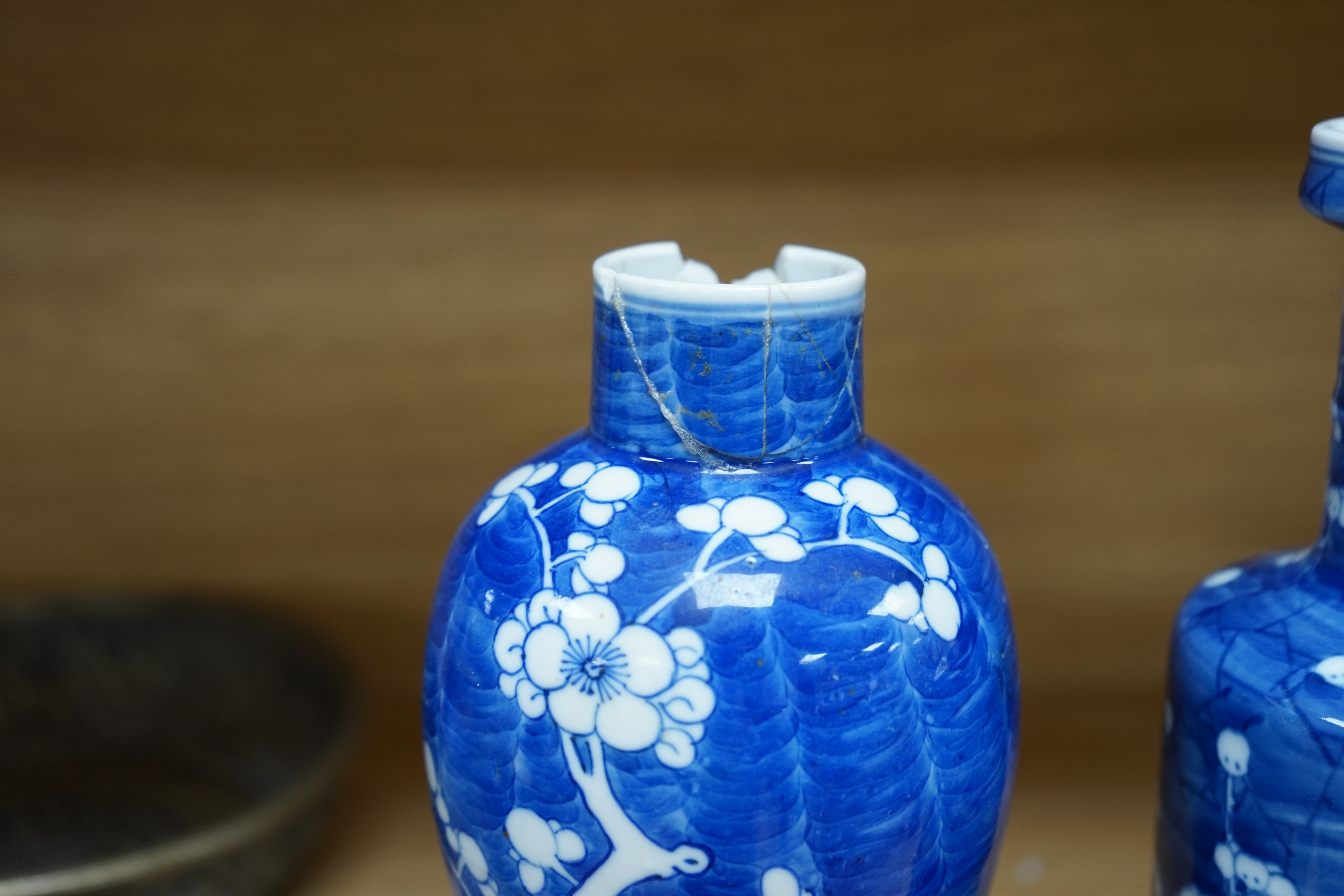 Three Chinese blue and white prunus vases. 25.5cm